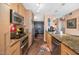 Modern kitchen with stainless steel appliances and island at 4808 N 24Th St # 803, Phoenix, AZ 85016