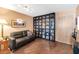 Living room with leather couch and built-in bookcase at 4808 N 24Th St # 803, Phoenix, AZ 85016