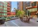 Relaxing outdoor patio area with tables and chairs, perfect for entertaining at 4808 N 24Th St # 803, Phoenix, AZ 85016