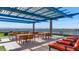 Community rooftop patio with seating, tables, and mountain views at 4808 N 24Th St # 803, Phoenix, AZ 85016