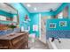 Charming bathroom with a unique blue color scheme, walk-in shower, and vintage vanity at 4944 E Windrose Dr, Scottsdale, AZ 85254