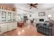 Living room with hardwood floors, fireplace, and built-in shelving at 4944 E Windrose Dr, Scottsdale, AZ 85254