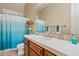 Clean bathroom with a single vanity, shower/tub combo and teal accents at 5045 S Mingus Pl, Chandler, AZ 85249