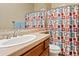 Bathroom with shower, sink, and colorful shower curtain at 5045 S Mingus Pl, Chandler, AZ 85249