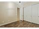 Bedroom with dark wood flooring and large closet at 5045 S Mingus Pl, Chandler, AZ 85249