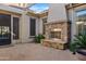 Outdoor fireplace and seating area in a private courtyard at 5045 S Mingus Pl, Chandler, AZ 85249