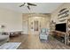 Bright living room with wood floors, a stone accent wall and views to the backyard at 5045 S Mingus Pl, Chandler, AZ 85249