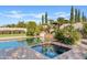 Resort-style pool and spa with lush landscaping at 5045 S Mingus Pl, Chandler, AZ 85249