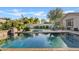 Refreshing pool and spa with lush greenery and patio furniture at 5045 S Mingus Pl, Chandler, AZ 85249