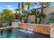 Tranquil waterfall feature adds to the pool's ambiance at 5045 S Mingus Pl, Chandler, AZ 85249