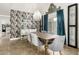 Bright dining area with a rustic wooden table and gray velvet chairs at 6318 N 14Th St, Phoenix, AZ 85014