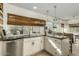 Modern kitchen with granite counters, white cabinets, and a kitchen island at 6318 N 14Th St, Phoenix, AZ 85014