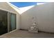 Serene patio with a statue and wooden deck at 6318 N 14Th St, Phoenix, AZ 85014