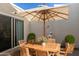 Charming patio features a wooden dining set and a statue at 6318 N 14Th St, Phoenix, AZ 85014