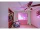 Bright bedroom with ceiling fan and closet at 6355 W Caron St, Glendale, AZ 85302