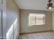 Simple bedroom with a ceiling fan and window blinds at 6355 W Caron St, Glendale, AZ 85302