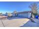 House exterior showcasing a driveway and a two-car garage at 6355 W Caron St, Glendale, AZ 85302