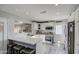 Modern kitchen with white cabinets, quartz countertops and island at 6355 W Caron St, Glendale, AZ 85302