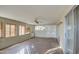 Sunroom with tile floor and ceiling fan at 6355 W Caron St, Glendale, AZ 85302