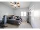 Bedroom featuring a king-size bed, built-in wardrobe, and ceiling fan at 7008 W Cesar St, Peoria, AZ 85345