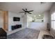 Living room with tile floors, ceiling fan, and view of kitchen at 7008 W Cesar St, Peoria, AZ 85345