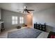 Living area with tile floors, ceiling fan, and lots of natural light at 7008 W Cesar St, Peoria, AZ 85345