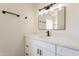 Updated bathroom with modern vanity and quartz countertop at 7101 W Laurel Ln, Peoria, AZ 85345