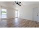 Bright bedroom with vaulted ceilings and wood-look flooring at 7101 W Laurel Ln, Peoria, AZ 85345