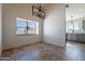 Bright dining area with tile floors and modern chandelier at 7101 W Laurel Ln, Peoria, AZ 85345