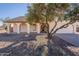 House exterior showcasing a spacious front yard and a charming entrance at 7101 W Laurel Ln, Peoria, AZ 85345