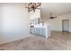 Open kitchen with grey cabinets and granite counters at 7101 W Laurel Ln, Peoria, AZ 85345