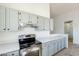 Modern kitchen with stainless steel appliances and light cabinets at 7101 W Laurel Ln, Peoria, AZ 85345