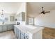 Open kitchen with grey cabinets and breakfast bar at 7101 W Laurel Ln, Peoria, AZ 85345