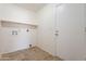 Laundry room with shelving and hookups at 7101 W Laurel Ln, Peoria, AZ 85345