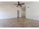 Living room featuring vaulted ceilings and tile flooring at 7101 W Laurel Ln, Peoria, AZ 85345