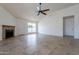 Living room with fireplace, tile floors and view of pool at 7101 W Laurel Ln, Peoria, AZ 85345