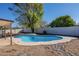 Inviting kidney-shaped pool in the backyard at 7101 W Laurel Ln, Peoria, AZ 85345