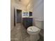 Clean bathroom with gray tiled floors and a toilet at 7309 S 17Th Dr, Phoenix, AZ 85041