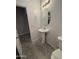 Bathroom with pedestal sink, toilet, and mirror at 7309 S 17Th Dr, Phoenix, AZ 85041