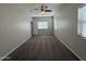 Spacious bedroom with ceiling fan and carpet at 7309 S 17Th Dr, Phoenix, AZ 85041