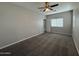 Bright bedroom with ceiling fan and window blinds at 7309 S 17Th Dr, Phoenix, AZ 85041