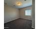 Spacious bedroom with carpeted floor and window with blinds at 7309 S 17Th Dr, Phoenix, AZ 85041