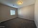 Simple bedroom with carpet and a window with blinds at 7309 S 17Th Dr, Phoenix, AZ 85041