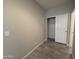 Small closet with sliding doors and tiled floor at 7309 S 17Th Dr, Phoenix, AZ 85041