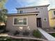 Two-story stucco home with tile roof, landscaping, and walkway at 7309 S 17Th Dr, Phoenix, AZ 85041