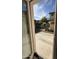 View of the front yard from inside the house showcasing the neighborhood at 7309 S 17Th Dr, Phoenix, AZ 85041