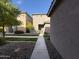 Front yard with walkway and landscaping at 7309 S 17Th Dr, Phoenix, AZ 85041