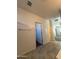 Clean hallway with tile floor and access to bedrooms at 7309 S 17Th Dr, Phoenix, AZ 85041