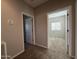 Upper hallway with carpet and doors to bedrooms at 7309 S 17Th Dr, Phoenix, AZ 85041