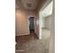 Hallway with carpet and access to bedrooms at 7309 S 17Th Dr, Phoenix, AZ 85041